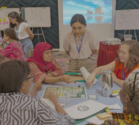 Women around a table user-testing a game