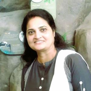 Dr. Bibha Kumari, Senior Environmental Expert and President of WAS-APC, smiling in professional attire against a neutral background.”