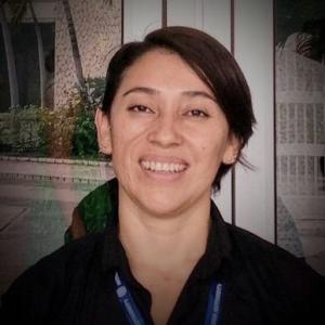 scientist, female, short hair, with blue badge strip 