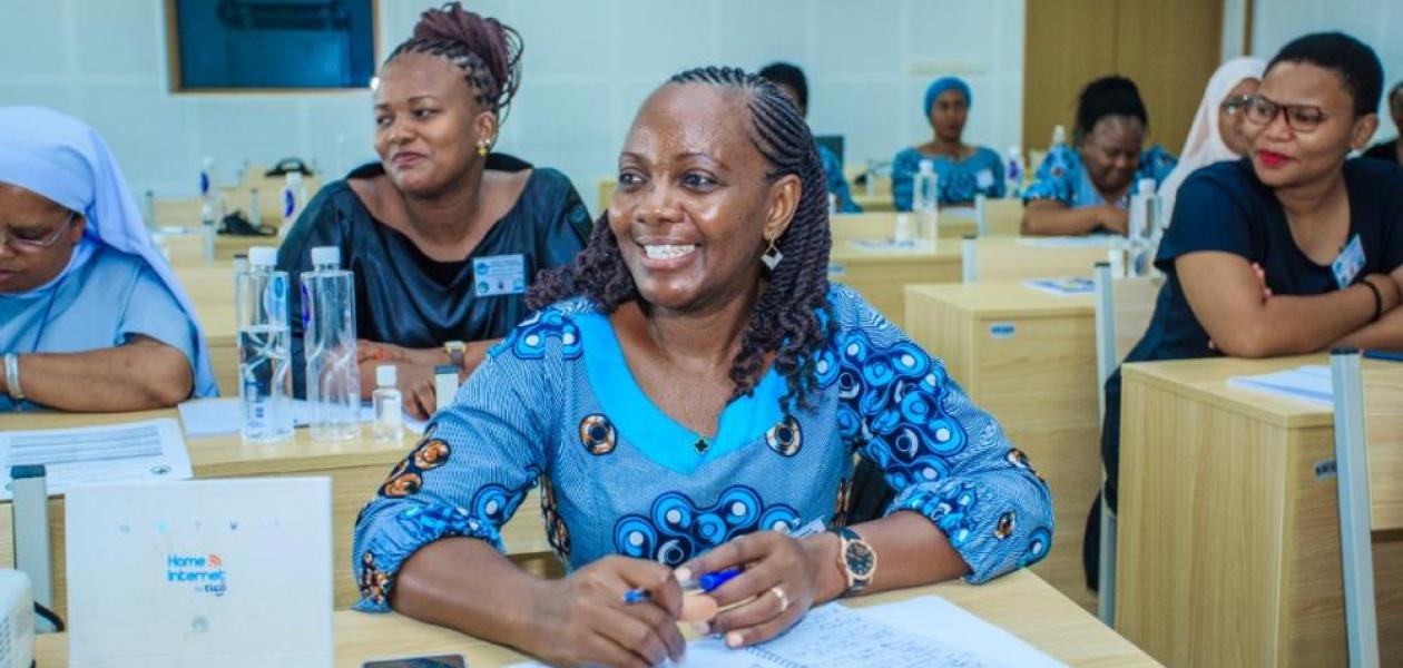 Smiling black woman attending a workshop